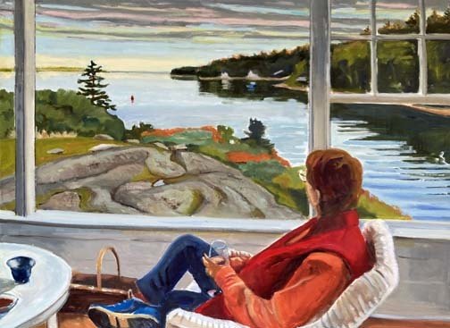 A guest enjoys a scenic ocean view from a Portland Maine boutique hotel room window.